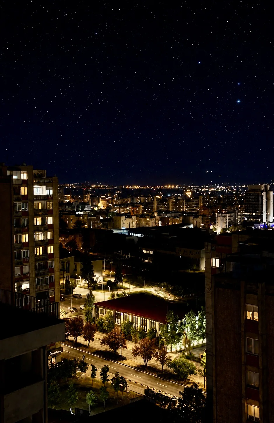Prishtina at night seen from the upper floors of Lusso boutique hotel